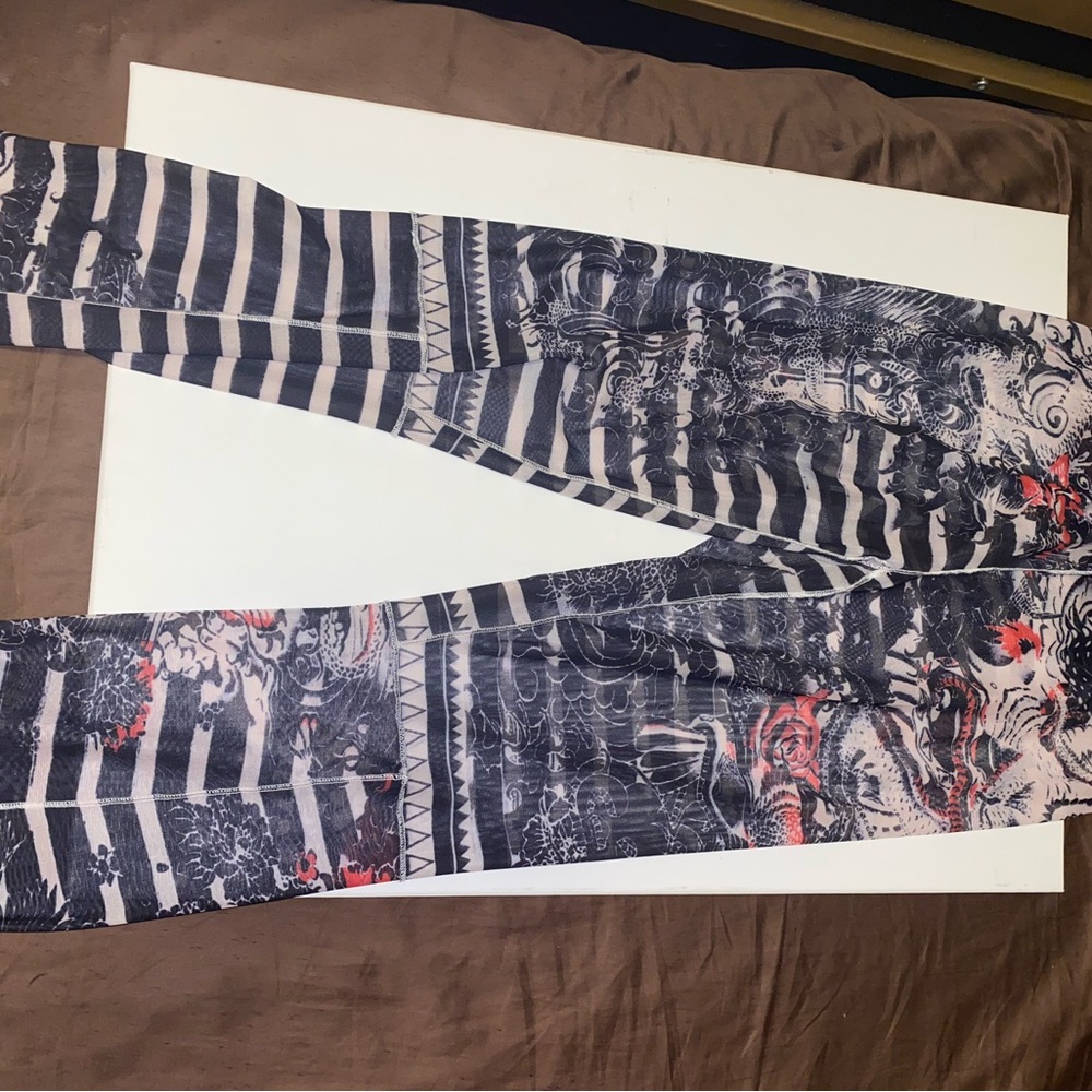Black and White Striped Leggings with Red Accents